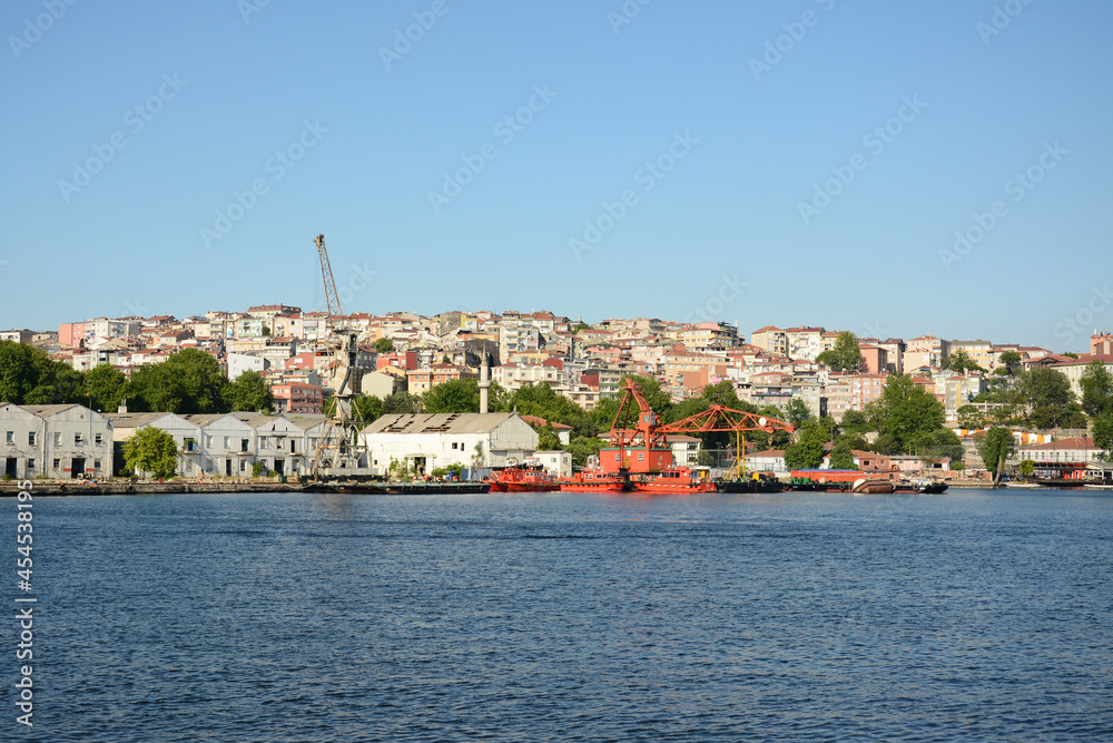 view of the port and houses in the city in sunny day