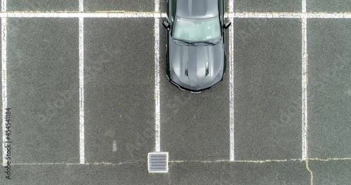 Aerial : Black muscle car at the parking