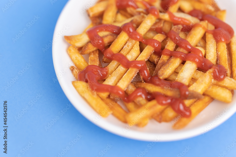French Fries with Ketchup on A White Plate, Food or Meal Background, Nobody French Fries with Ketchup on A White Plate, Food or Meal Background, Nobody