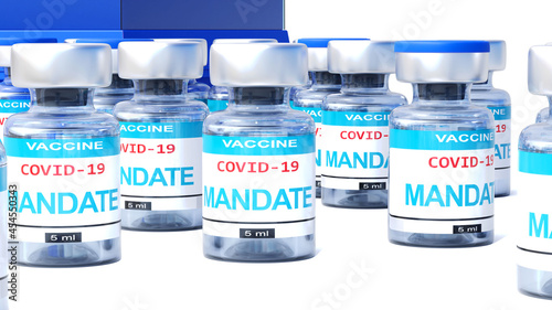 Covid mandate - vaccine bottles with an English label Mandate that symbolize a big human achievement that may end the fight with the coronavirus pandemic, 3d illustration photo