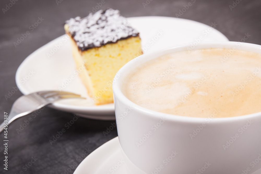 Coffee with milk and fresh baked cheesecake. Delicious dessert Coffee with milk and fresh baked cheesecake. Delicious dessert
