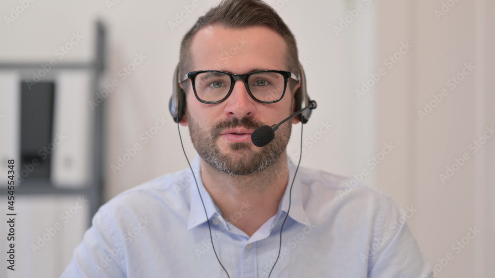 Portrait of Middle Aged Man Talking on Headset Portrait of Middle Aged Man Talking on Headset