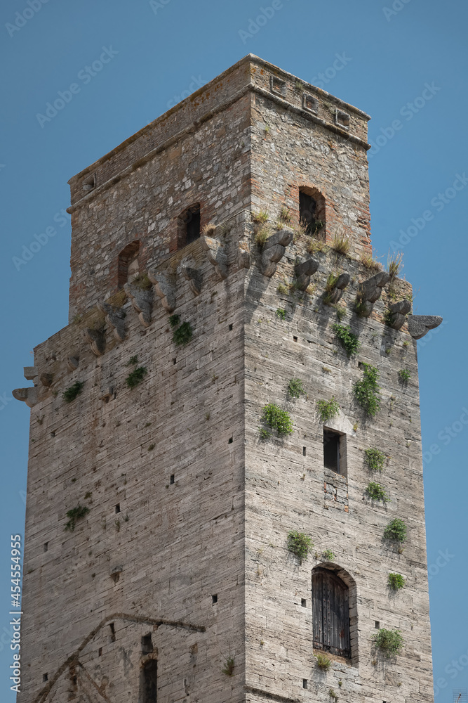 The historic center of San Gimignano, a typical medieval village in Tuscany. Narrow streets, numerous stone towers characterize the urban landscape