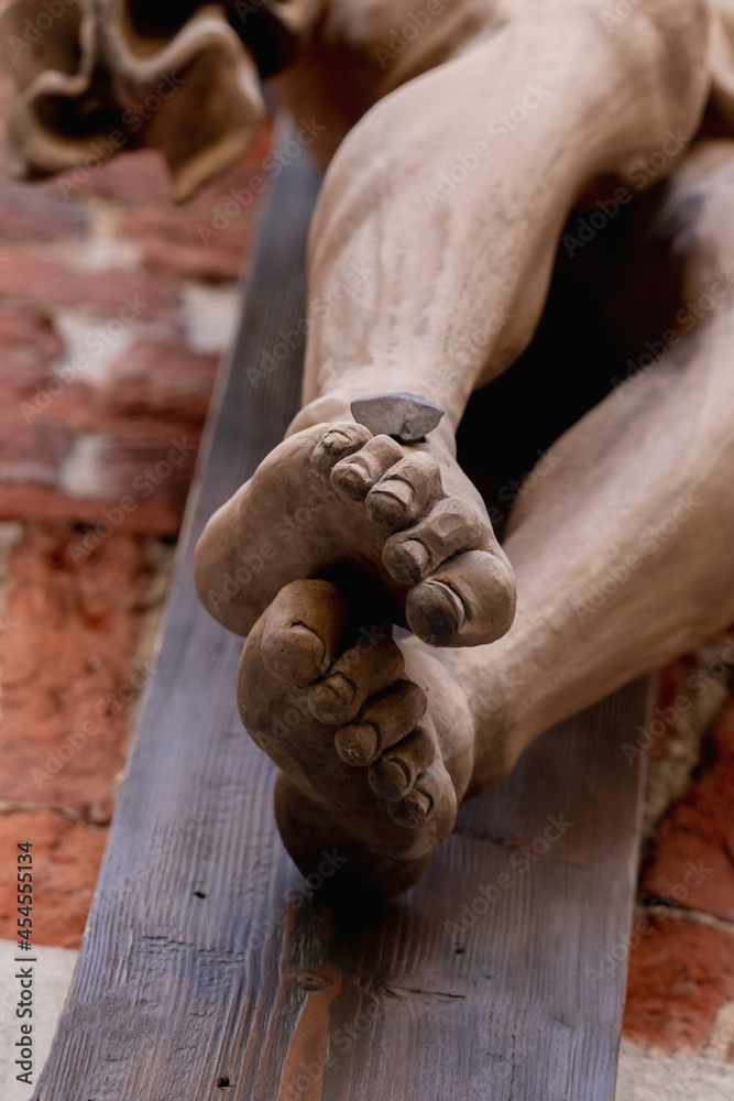 Crucifixion of God, Jesus Christ. Bottom view. An ancient statue. Grace, good, ascension concept. Crucifixion of God, Jesus Christ. Bottom view. An ancient statue. Grace, good, ascension concept.