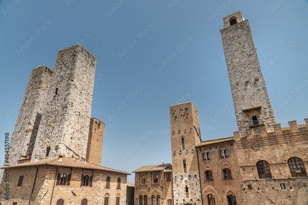 The historic center of San Gimignano, a typical medieval village in Tuscany. Narrow streets, numerous stone towers characterize the urban landscape