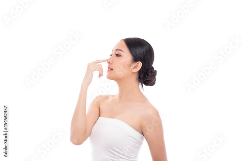 Beautiful spa Asian model girl with make up and beauty healthy skin color lips red and hair portrait. Beauty woman perfect face fresh clean skin portrait isolated on white background. Studio shot.