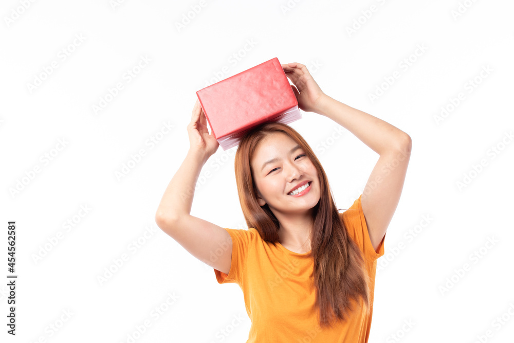Attractive Asian woman holding gift box in christmas, new year, valentine day, birthday celebration concept. Portrait of smiling happy pretty girl hold gift box isolated on white with copy space. Attractive Asian woman holding gift box in christmas, new year, valentine day, birthday celebration concept. Portrait of smiling happy pretty girl hold gift box isolated on white with copy space.
