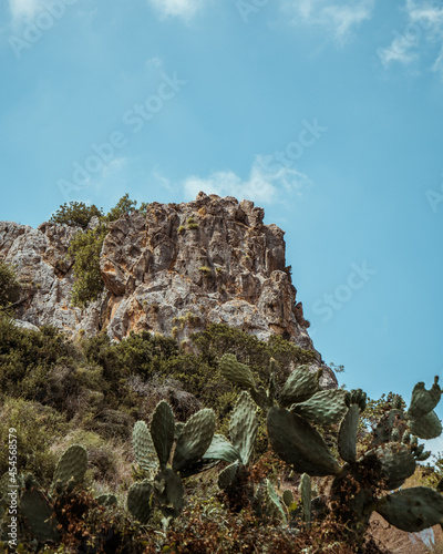 Sharp rock side of the mountain with cactuses, Tuf Kerem Maharal, Israel photo