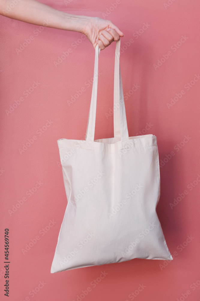 White tote bag on pink vertical background. Stock Photo | Adobe Stock