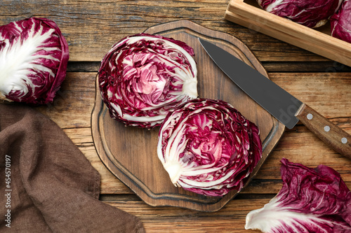 Fresh ripe radicchios on wooden table, flat lay