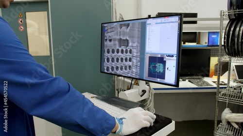 Factory of modern electronics: scientist, engineer working on a computer with software. Develops design, development of industrial printed circuit boards, silicon microcircuits, semiconductors, teleco photo