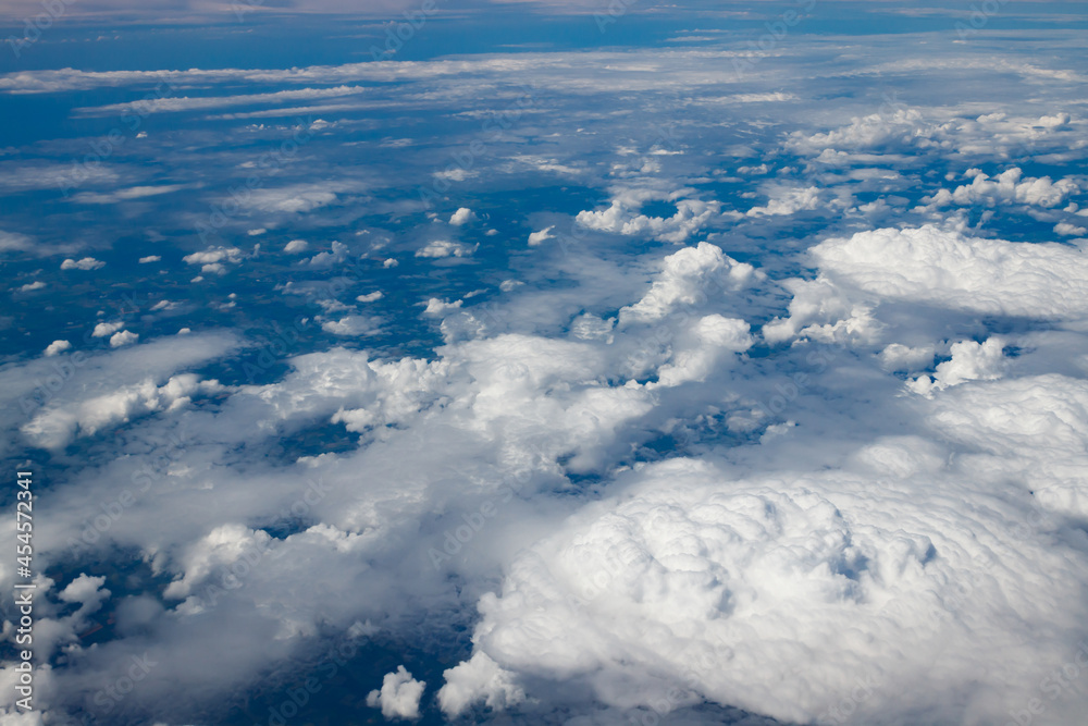 Aerial view to beautiful clouds from plane. Flight from Helsinki to Amsterdam. Aerial view to beautiful clouds from plane. Flight from Helsinki to Amsterdam.