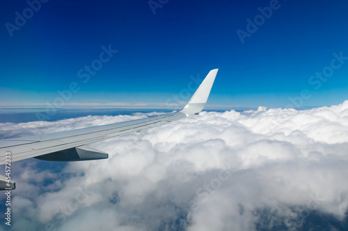 Plain wing over blue sky. Flight from Helsinki to Amsterdam. © Elena Noeva