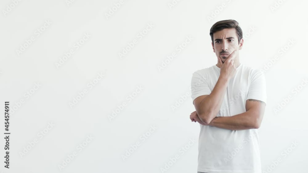 Caucasian Male Placed on the Right Interpreting Doubtful Expression with White Background for Commercial Use Caucasian Male Placed on the Right Interpreting Doubtful Expression with White Background for Commercial Use