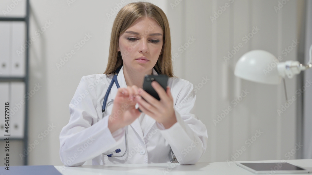 Female Doctor using Smartphone at Work Female Doctor using Smartphone at Work