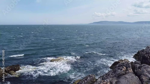 Waves over rocks in Co Antrim Northern Ireland  photo
