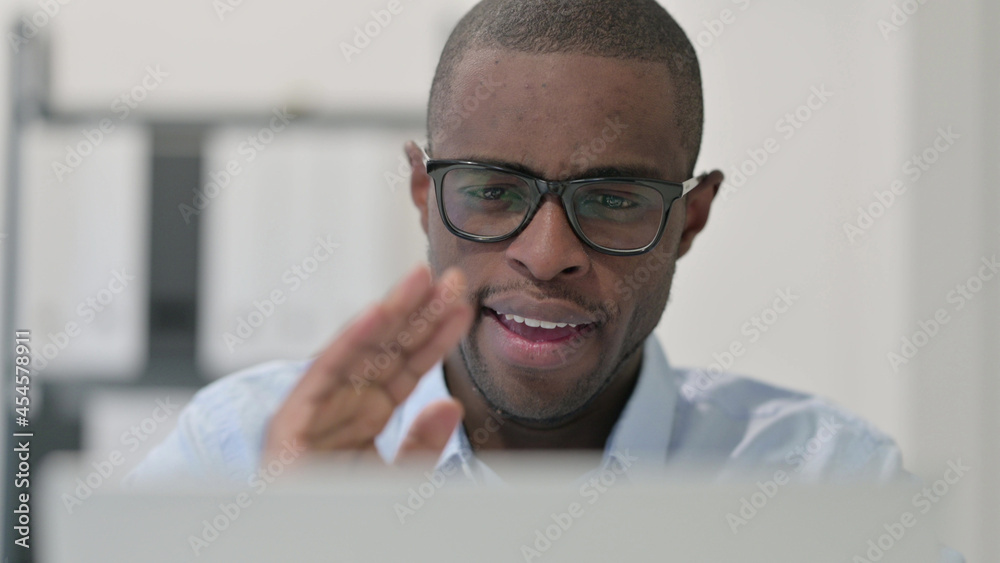 Close up of African Man doing Video Chat on Laptop Close up of African Man doing Video Chat on Laptop
