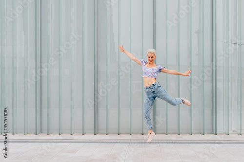 Young caucasian woman outdoor jumping celebrating success feeling free