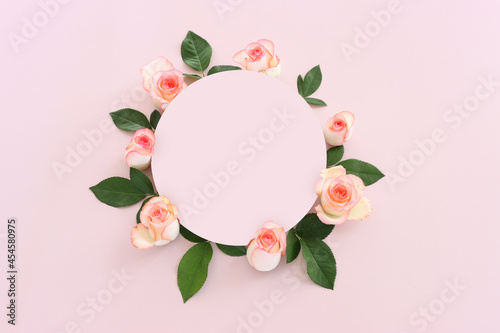 Pastel delicate background with pink roses and petals. Top view © tomertu