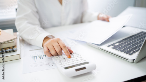 Fototapeta Naklejka Na Ścianę i Meble -  Auditor or internal revenue service staff, Business women checking annual financial statements of company. Audit Concept