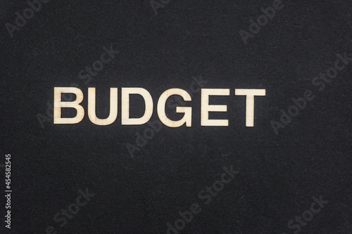 BUDGET word written on dark paper background. BUDGET text for your concepts