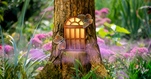 Fotografie Fantasy fairy tale forest with magical shining window of enchanted elf or gnome