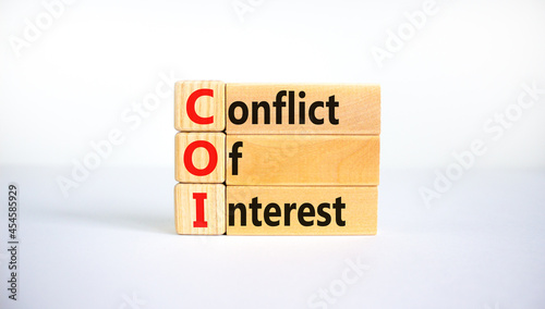 COI, Conflict of interest symbol. Wooden blocks with concept words 'COI, conflict of interest'. Beautiful white background. Copy space. Business and COI, conflict of interest concept.