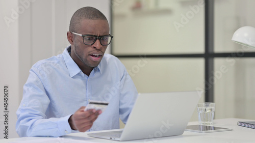 Online Shopping Failure for African Man on Laptop