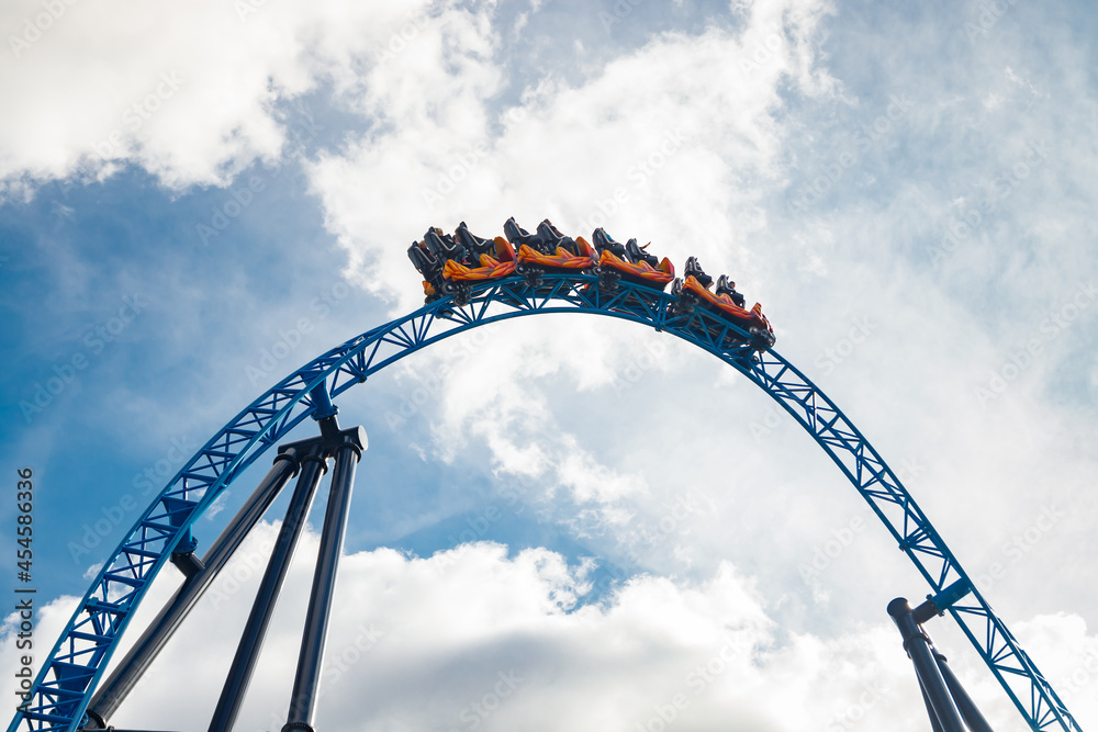 Ride roller coaster in motion in amusement park Ride roller coaster in motion in amusement park