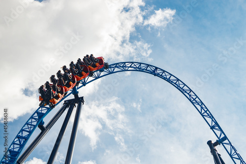 Ride roller coaster in motion in amusement park © Elena Noeva