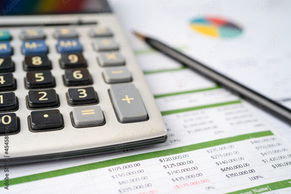 Calculator on graph paper. Finance development, Banking Account, Statistics, Investment Analytic research data economy, Stock exchange trading, Business company concept. Calculator on graph paper. Finance development, Banking Account, Statistics, Investment Analytic research data economy, Stock exchange trading, Business company concept.