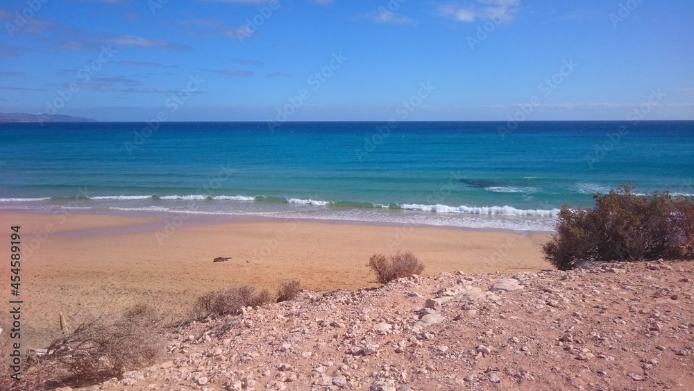 Calm empty beach on bright sunny day on Canary islands
