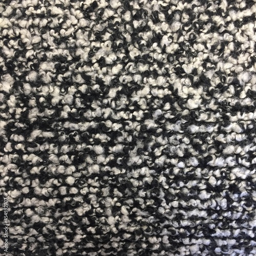 Black and white boucle knitted fluffy fabric texture