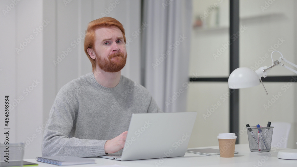 Beard Redhead Man with Laptop Shaking Head as No Sign at Work Beard Redhead Man with Laptop Shaking Head as No Sign at Work