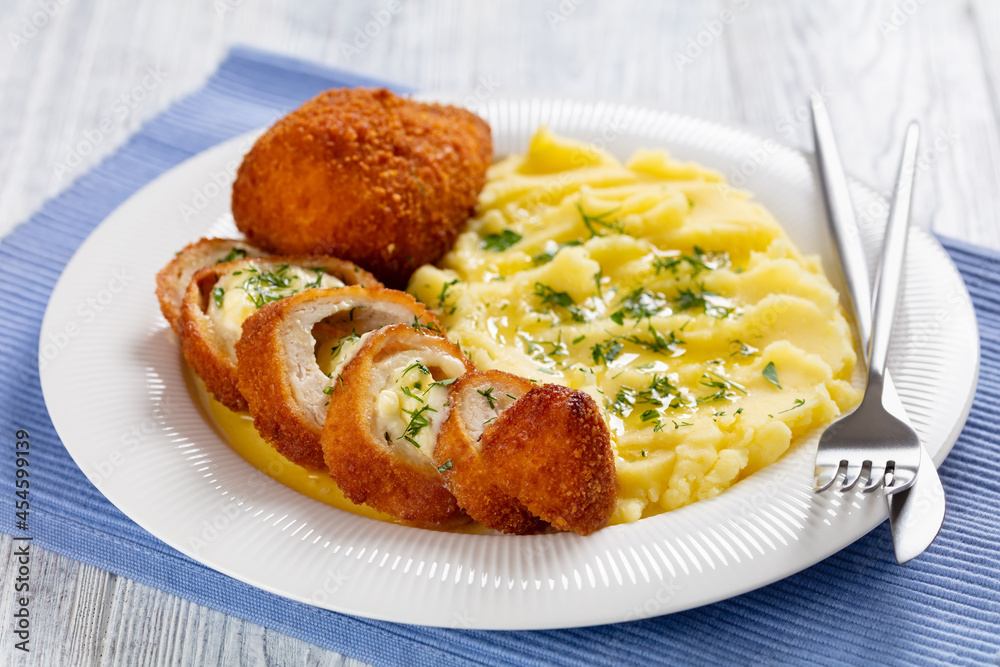 Chicken Kiev served with potato mash on a plate