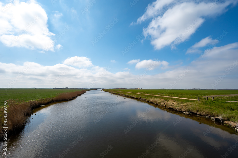 Dutch landscape, polders and water channels in Zeeland, Netherlands Dutch landscape, polders and water channels in Zeeland, Netherlands