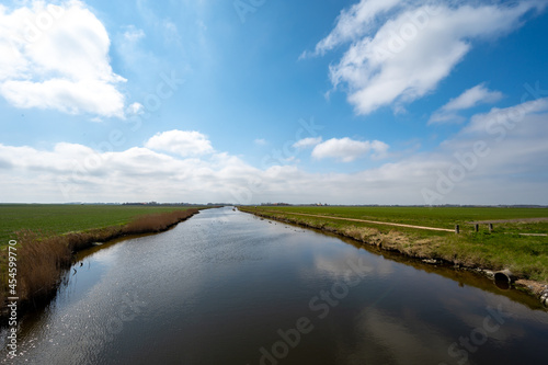 Fototapeta Dutch landscape, polders and water channels in Zeeland, Netherlands