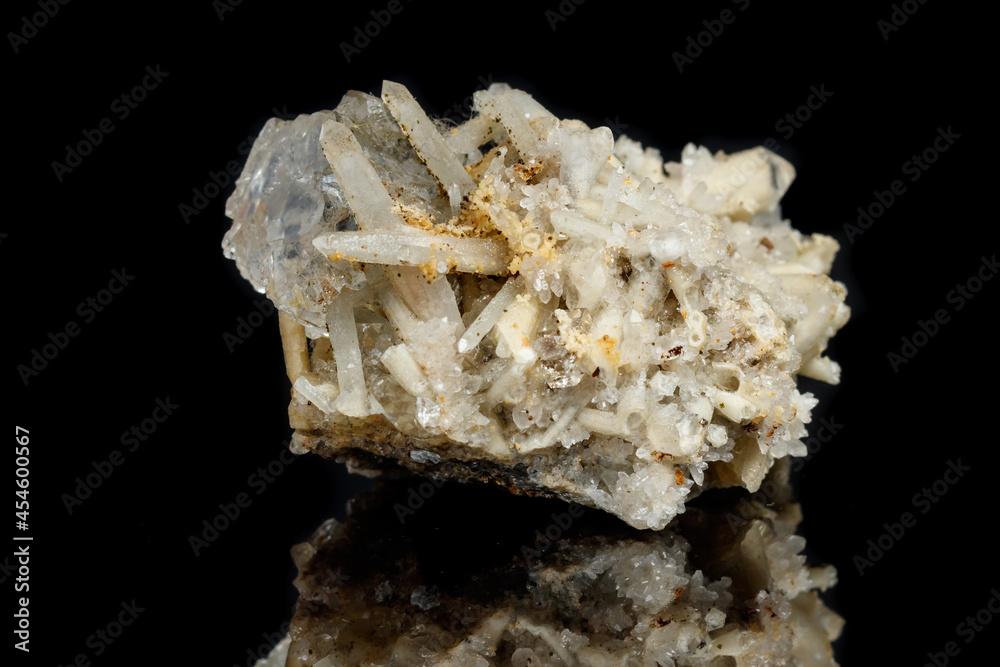 Macro mineral stone fluorite with quartz against black background Macro mineral stone fluorite with quartz against black background