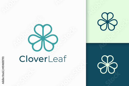 Clover logo in simple line and love shape represent lucky