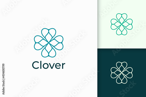 Clover logo in simple line and love shape represent lucky
