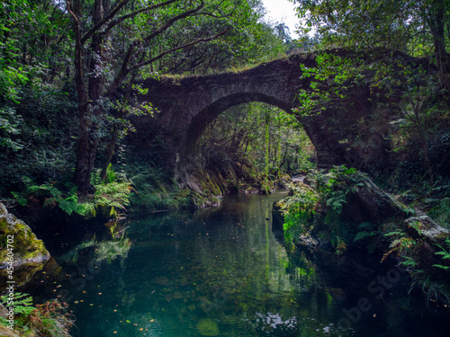 Ancient Roman bridge over the Polea river in Villayon, Asturias, Spain.