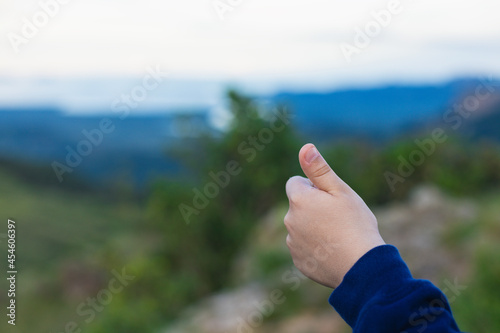 thumb up on the mountain