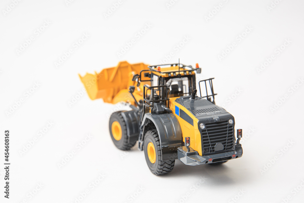 Highly detailed yellow single-bucket forklift, scale model of specialized equipment on white background, bulk loader.