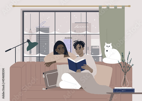 Cozy winter interior, a couple reading a book together, Christmas holidays