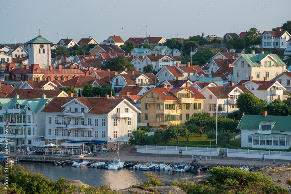 Marstrand island panorama Scenery with Harbour and boats in the canal and Carlsten's fortress against the blue sky in west caost of Sweden.