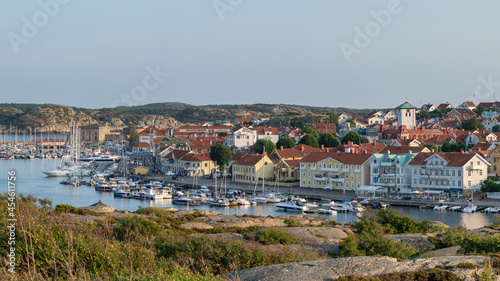 Marstrand island panorama Scenery with Harbour and boats in the canal and Carlsten's fortress against the blue sky in west caost of Sweden. photo