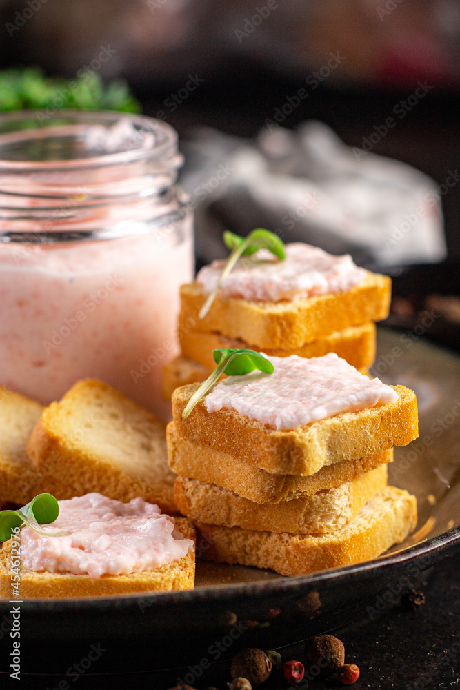 Smorrebrod butter spread shrimp on bread capelin roe seafood taste fresh portion ready to eat meal snack on the table copy space food background rustic. top view pescetarian diet vegetarian food 