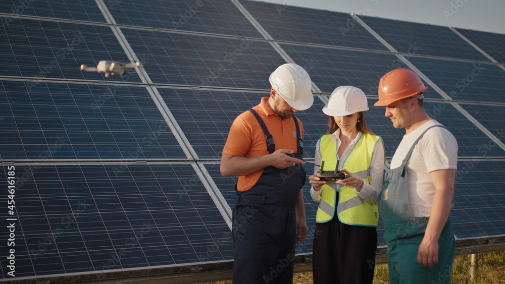 Technician and investor Using Infrared Drone Technology to Inspect Solar Panels and Wind Turbines in Solar cell Farm, Solar cells will be an important renewable energy of the future. Solar panel Technician and investor Using Infrared Drone Technology to Inspect Solar Panels and Wind Turbines in Solar cell Farm, Solar cells will be an important renewable energy of the future. Solar panel