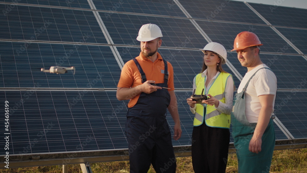 Technician and investor Using Infrared Drone Technology to Inspect Solar Panels and Wind Turbines in Solar cell Farm, Solar cells will be an important renewable energy of the future. Solar panel Technician and investor Using Infrared Drone Technology to Inspect Solar Panels and Wind Turbines in Solar cell Farm, Solar cells will be an important renewable energy of the future. Solar panel