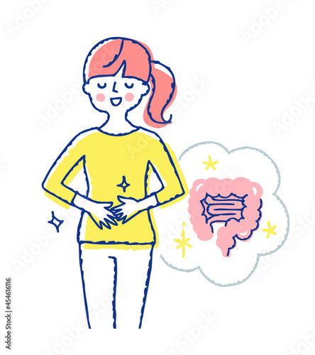お腹に手を当てている笑顔の女性　健康的な腸のイメージ photo
